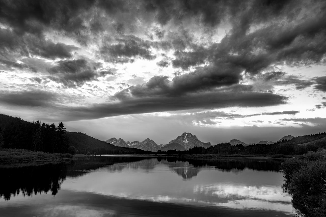 Grand Teton reflecting in a lake.