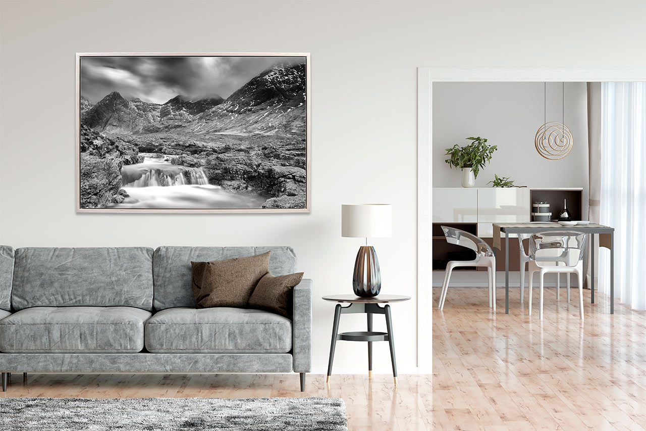 A fine art print in black and white of the Isle of Skye exposed in a living room of an apartment.