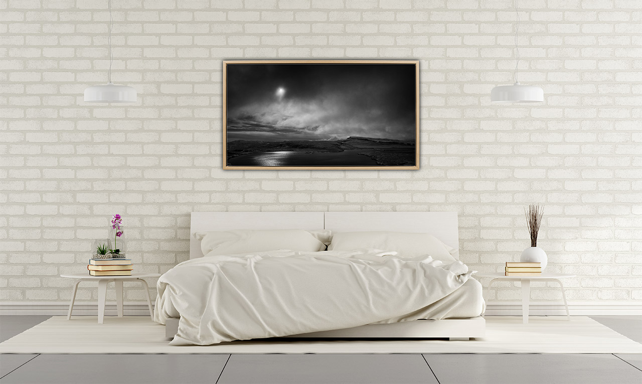 A fine art print in black and white of the Isle of Skye exposed in a master bedroom.
