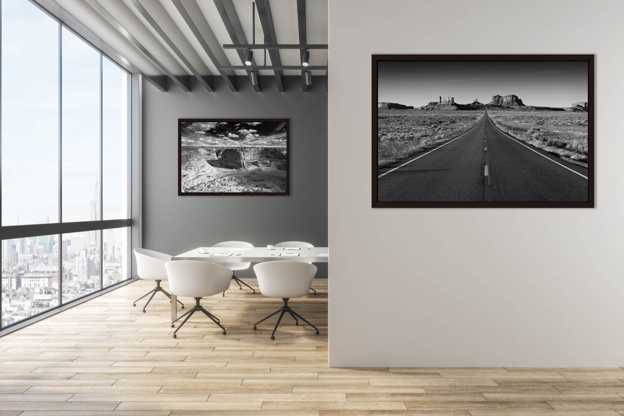 Two black and white fine art prints of the southwest of USA exposed in a office.