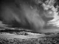 Photo in black and white of a storm over Yellowstone.