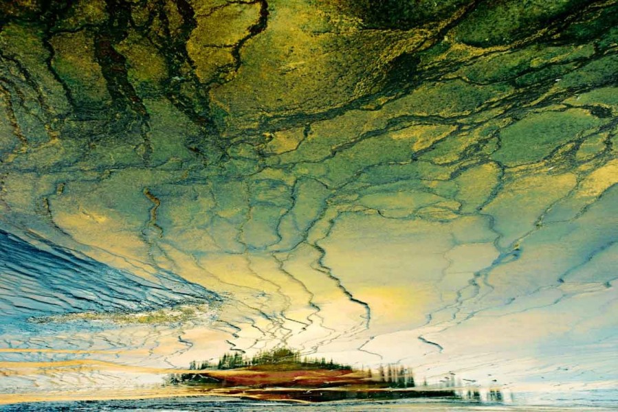 Reflection on water of a landscape of Yellowstone. Conceptual ph Reflection on water of a landscape of Yellowstone. Conceptual ph