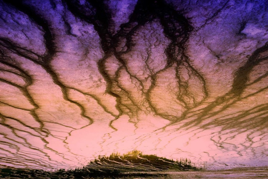 Reflection on water of a landscape of Yellowstone. Conceptual ph Reflection on water of a landscape of Yellowstone. Conceptual ph