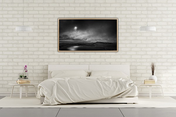 A fine art print in black and white of the Isle of Skye exposed in a master bedroom.