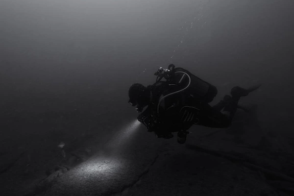 Scuba diver exploring the Recoin wreck off the coast of Oleron Island in France.