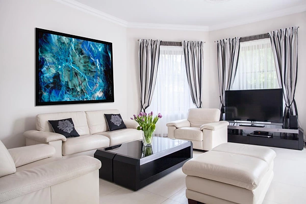 An abstract art photo displayed in a contemporary living room decor.